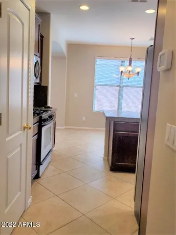 an empty room with closet and mirror