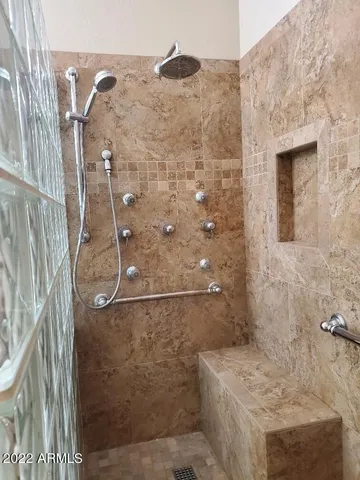 a white toilet sitting next to a bathroom sink