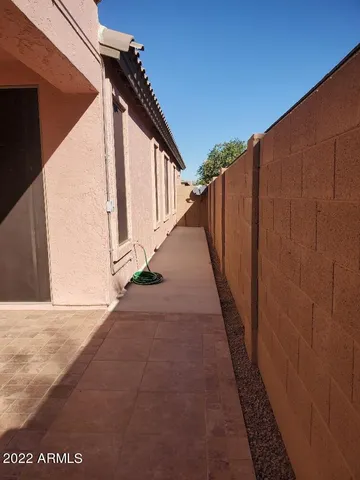 a backyard of a house with outdoor seating