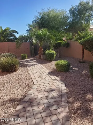 a view of backyard with trampoline