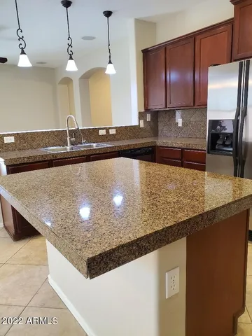 a kitchen with a sink and a stove