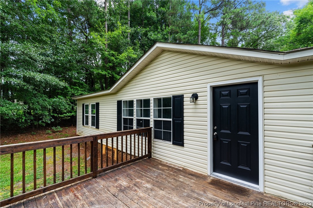 287 Doyle Cox Road Sanford, NC 27330 - Photo 28 of 35 a view of a house with a deck