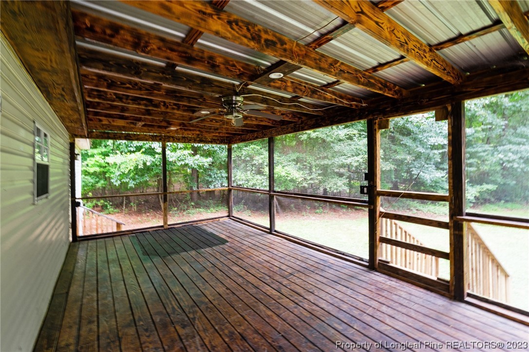 287 Doyle Cox Road Sanford, NC 27330 - Photo 31 of 35 a view of porch with wooden floor