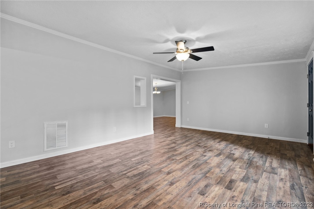 287 Doyle Cox Road Sanford, NC 27330 - Photo 4 of 35 a view of empty room with wooden floor