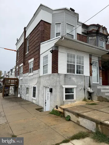 a view of a white building among the street