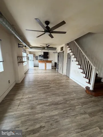a view of a livingroom with wooden floor