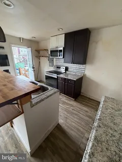 a kitchen with a stove and a refrigerator