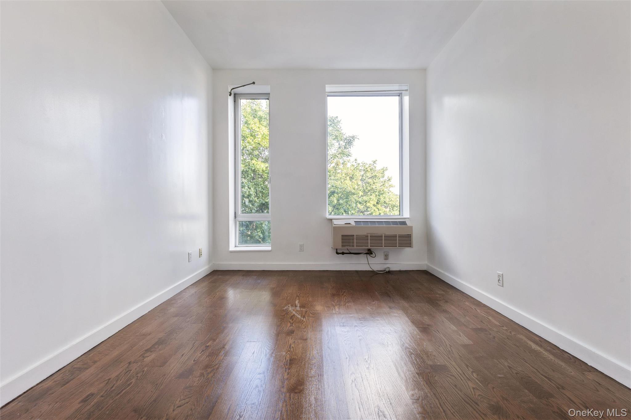 111 Monroe Street, Unit 4F Brooklyn, NY 11216 - Photo 16 of 25 Ample Bedroom setting with wood floors