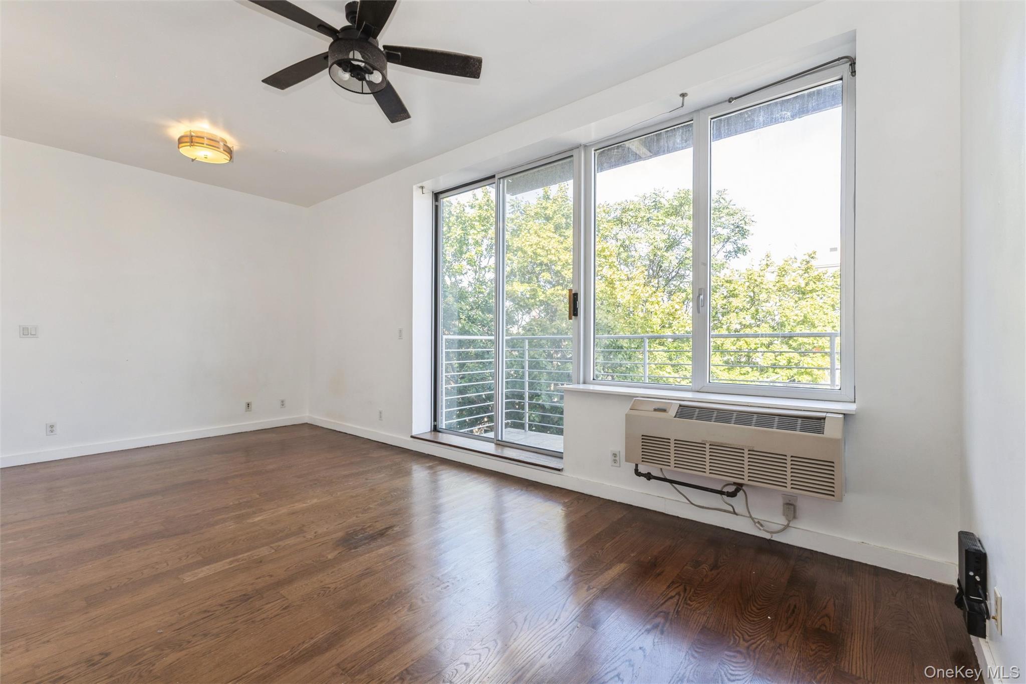 111 Monroe Street, Unit 4F Brooklyn, NY 11216 - Photo 3 of 25 Living room with access to private balcony