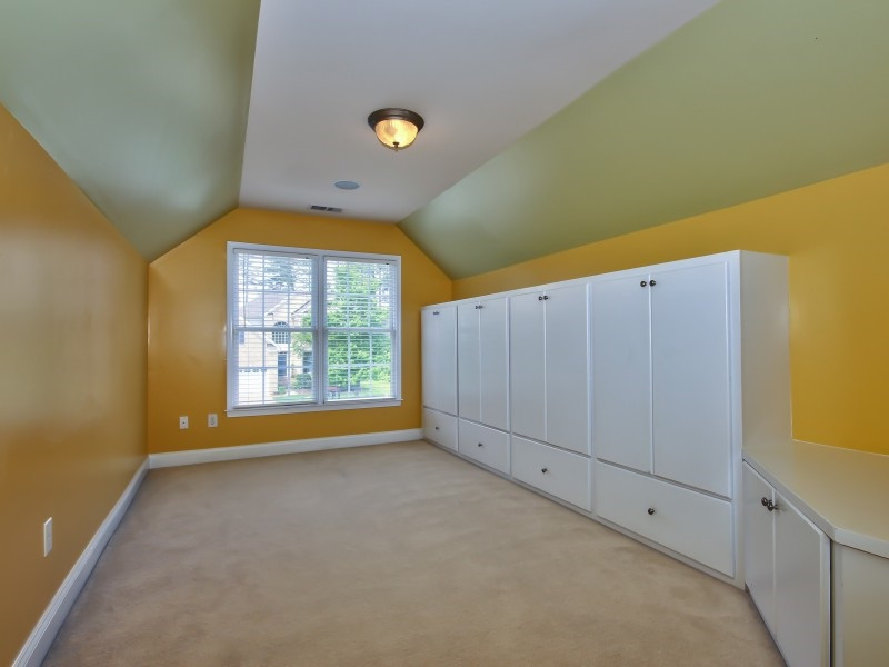 9612 Heathermill Lane Raleigh, NC 27617 - Photo 19 of 25 a view of an empty room with a window
