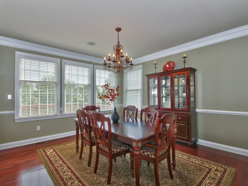 9612 Heathermill Lane Raleigh, NC 27617 - Photo 5 of 25 a view of a dining room with furniture window and wooden floor