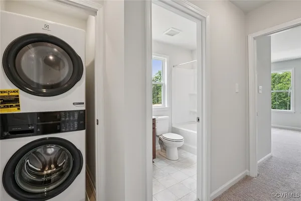 a view of a bathroom with a washer and dryer