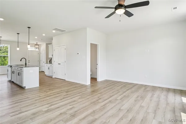 a view of a kitchen with a sink and cabinets