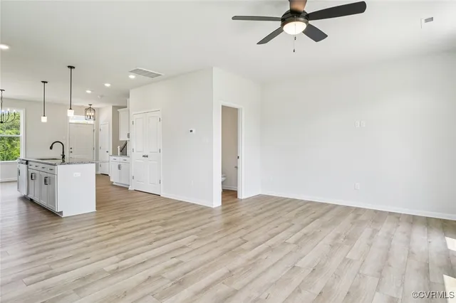 a view of a kitchen with a sink and cabinets