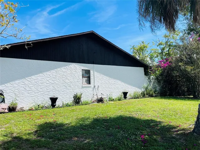a backyard of a house with lots of green space