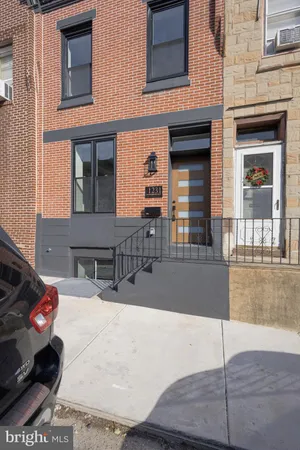 a view of a building with car parked