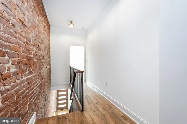 a view of entryway with wooden floor
