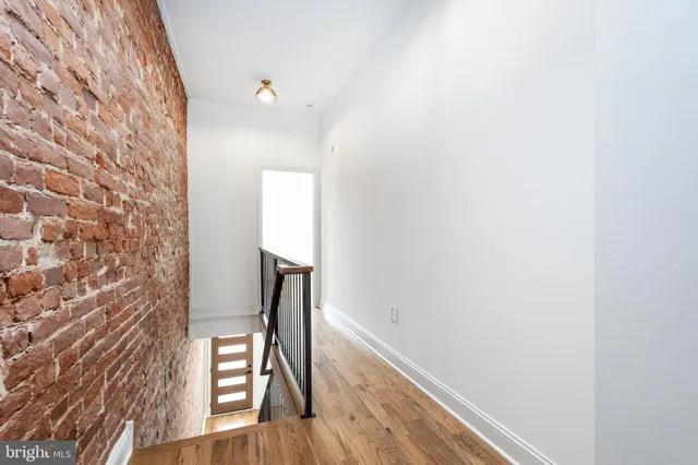 a view of entryway with wooden floor