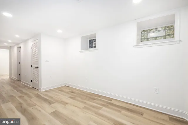 a bathroom with a sink toilet vanity and bathtub