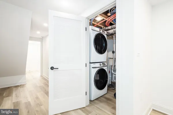 a bathroom with a white bathtub and toilet