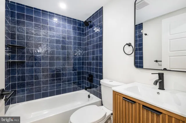 a view of a brick house with many windows