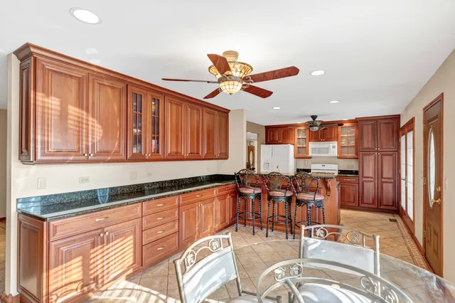 a view of a a dining room with furniture window and outside view