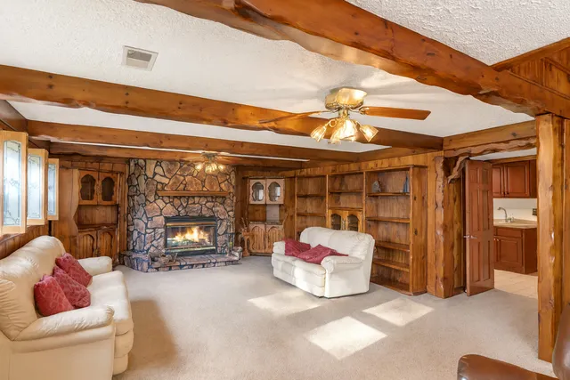 a kitchen with stainless steel appliances sink cabinets and window