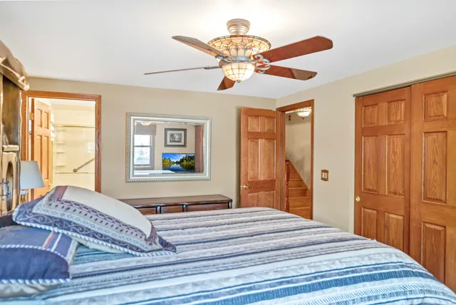 a room with pool table and window