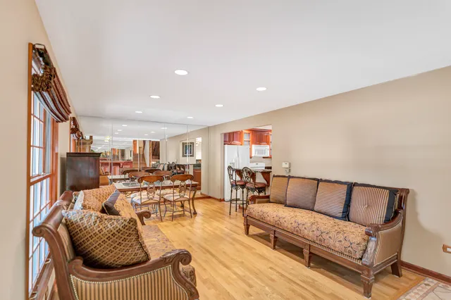 a dining room with furniture and window