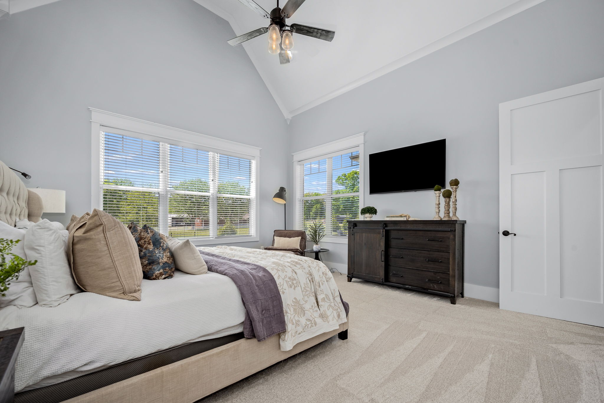 12365 Hogwood Road Milton, TN 37118 - Photo 23 of 59 a bedroom with a bed and a flat screen tv