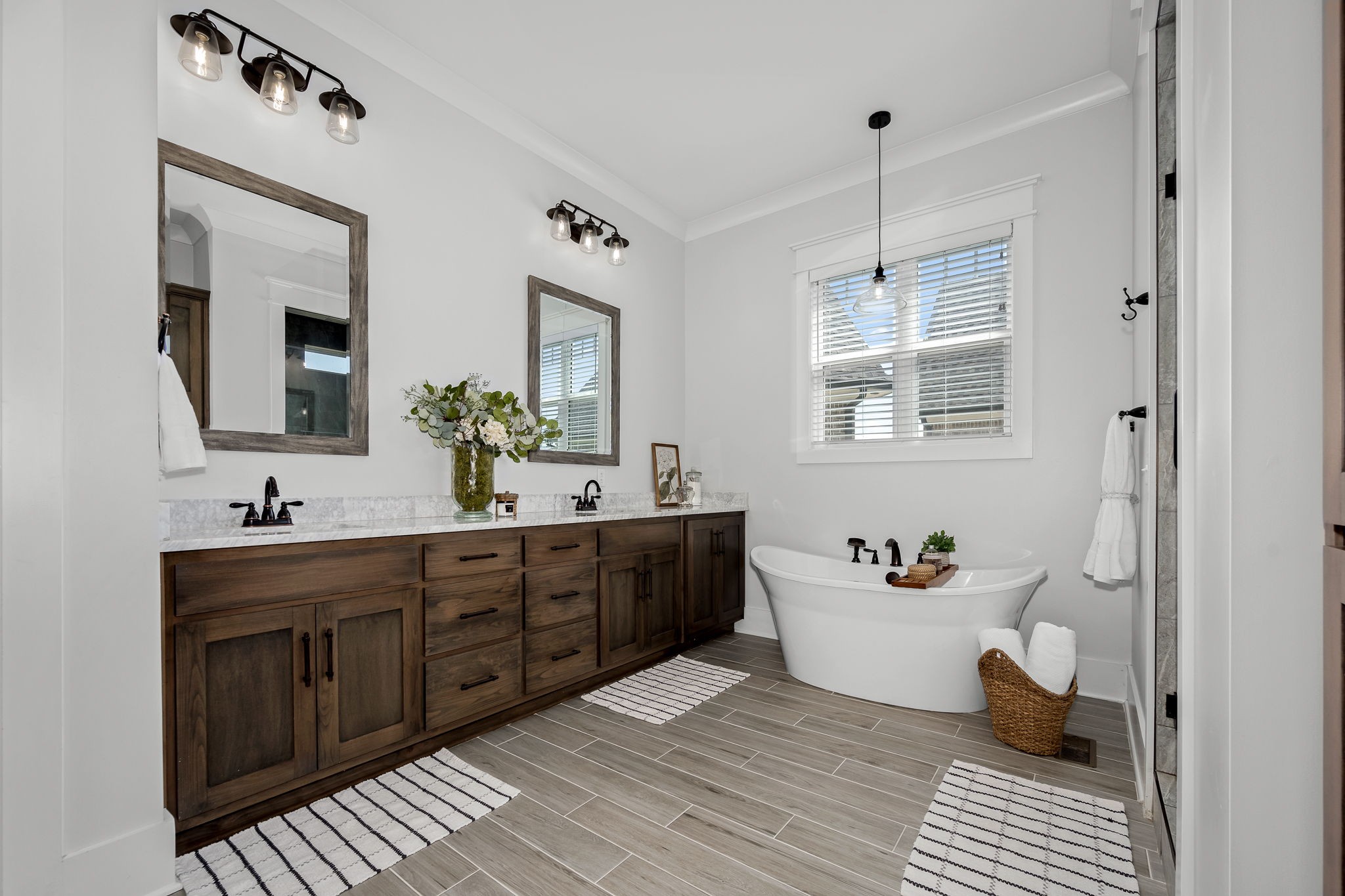 12365 Hogwood Road Milton, TN 37118 - Photo 24 of 59 a spacious bathroom with a double vanity sink a mirror and a bathtub