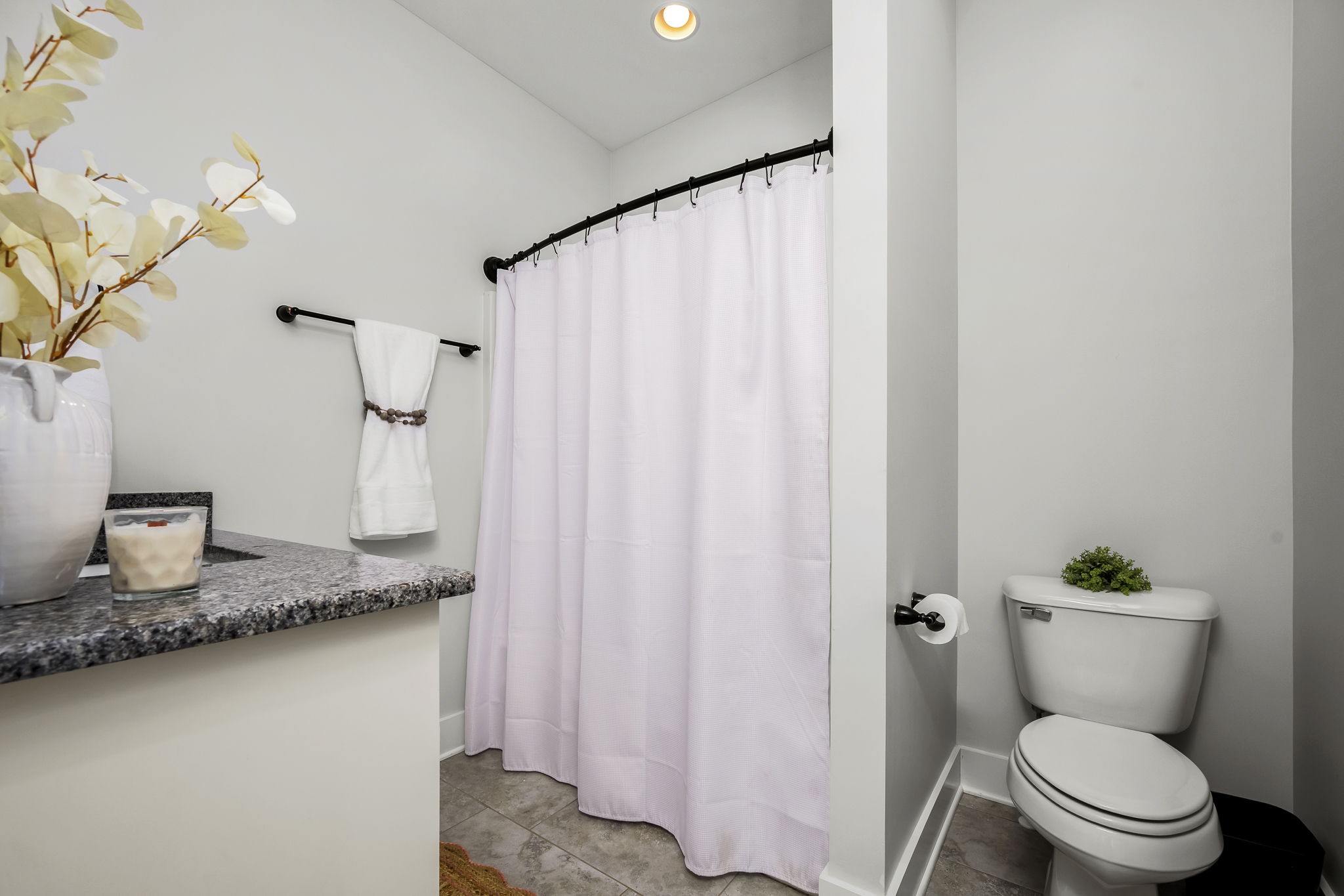 12365 Hogwood Road Milton, TN 37118 - Photo 39 of 59 a bathroom with a granite countertop sink and a toilet