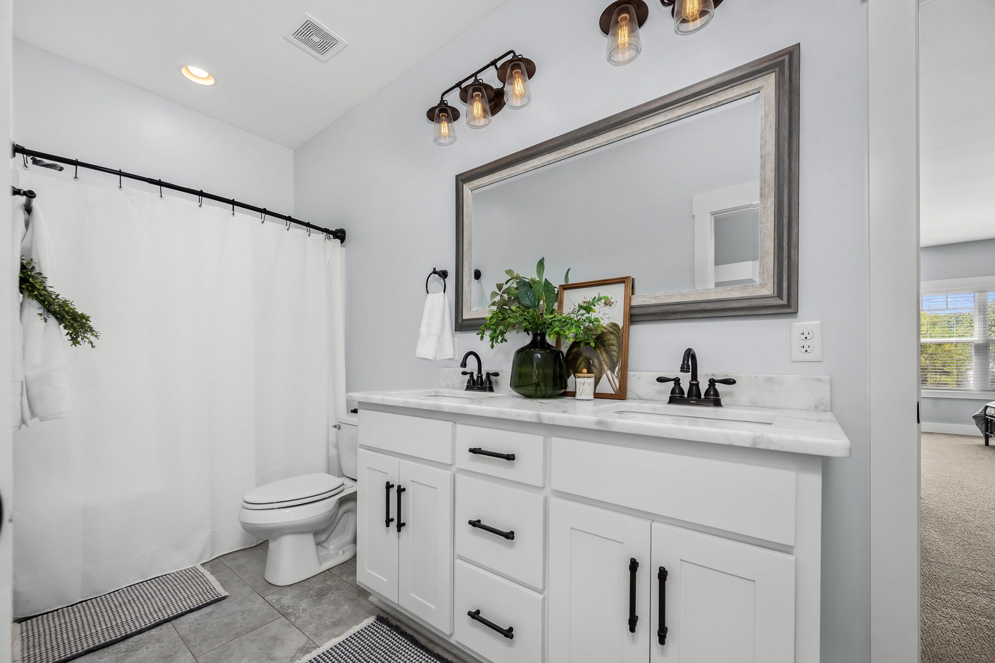12365 Hogwood Road Milton, TN 37118 - Photo 42 of 59 a bathroom with a sink a toilet and a mirror