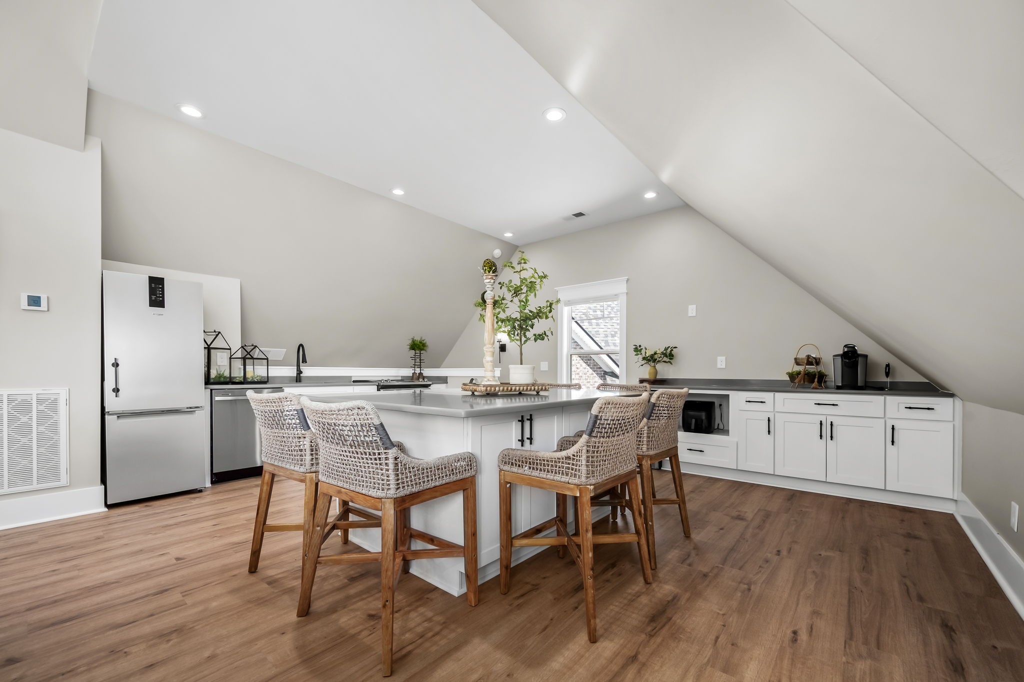 12365 Hogwood Road Milton, TN 37118 - Photo 45 of 59 a kitchen with stainless steel appliances a dining table chairs and wooden floor