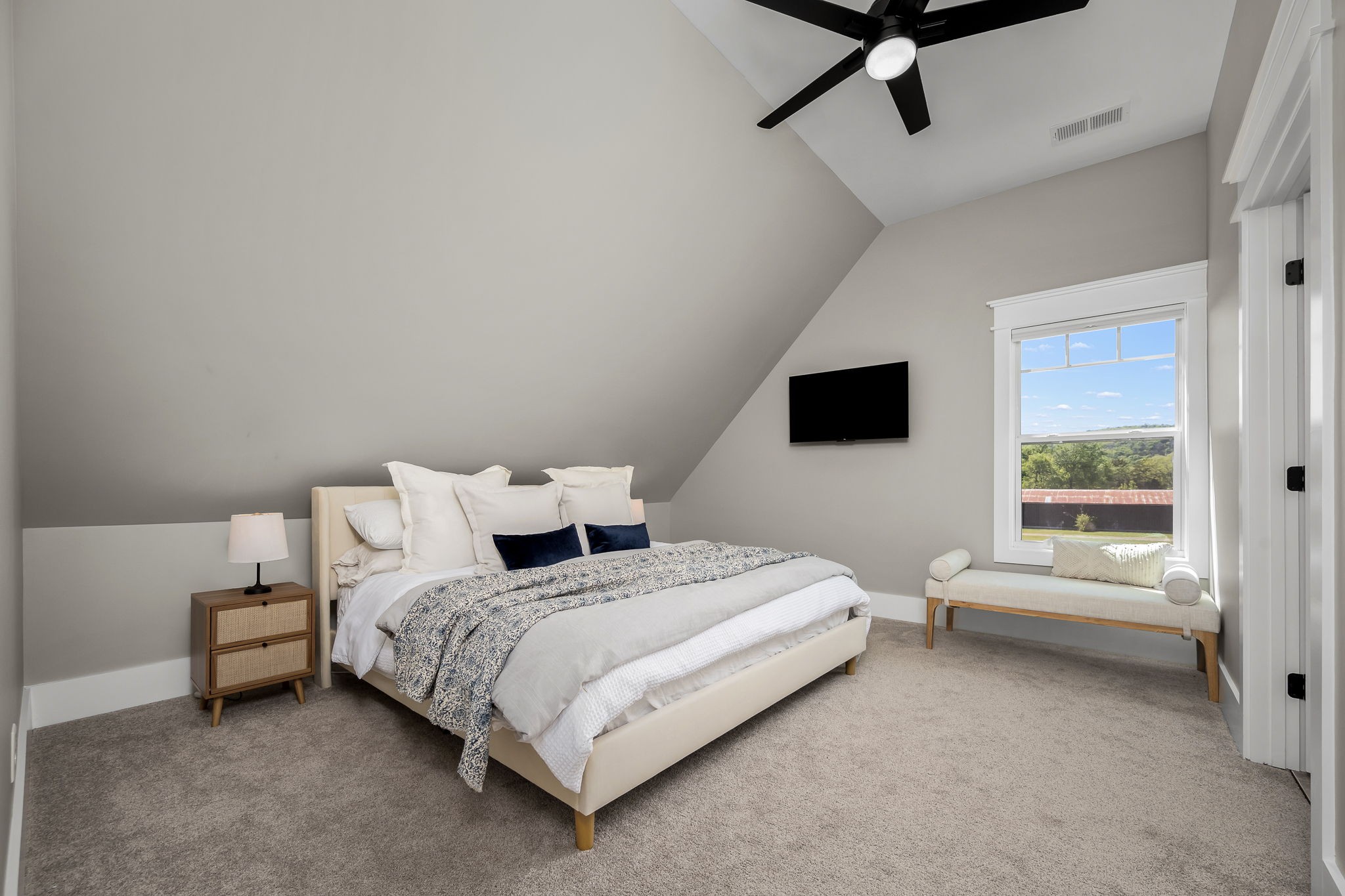 12365 Hogwood Road Milton, TN 37118 - Photo 47 of 59 a bedroom with a bed and a flat tv screen