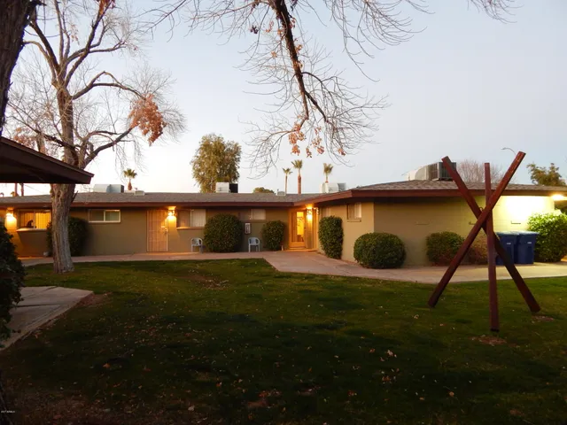 a view of a yard with a tree