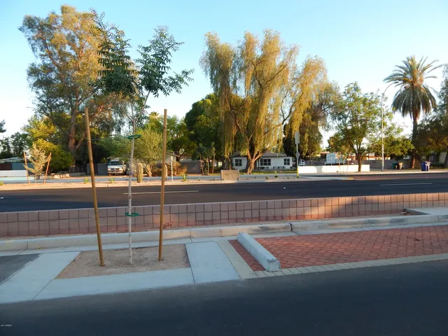 a view of parked car with a yard