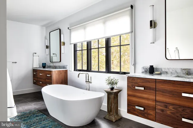 a room with a bed and a chandelier