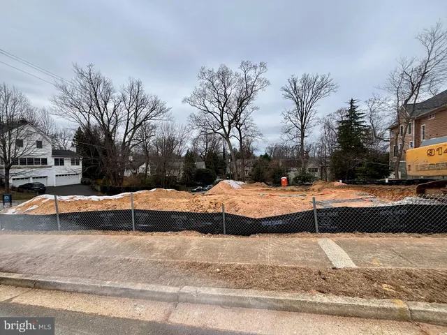 a large kitchen with kitchen island a large island a sink stainless steel appliances and windows