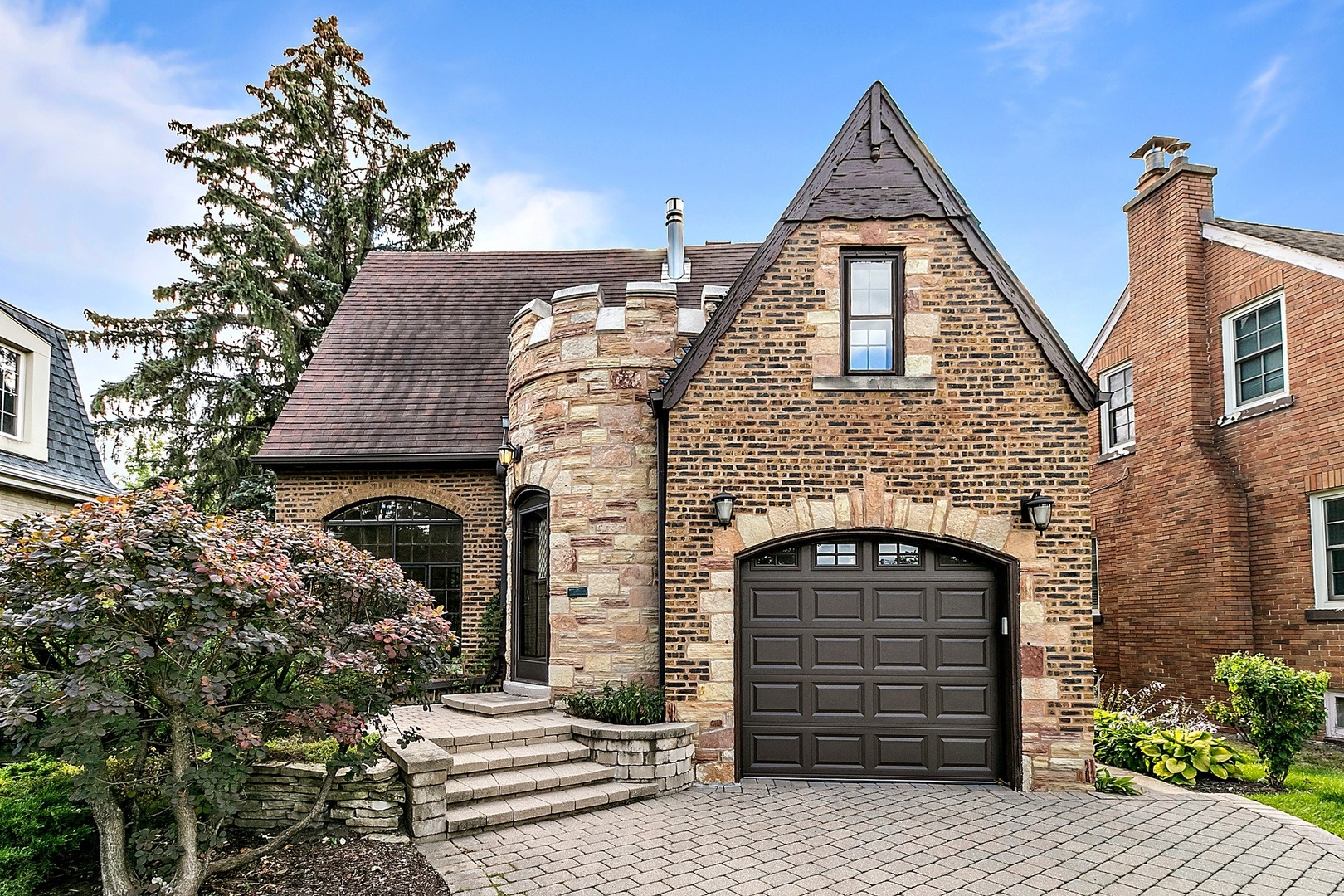 595 Selborne Road Riverside, IL 60546 - Photo 1 of 25 a front view of a house with a garden