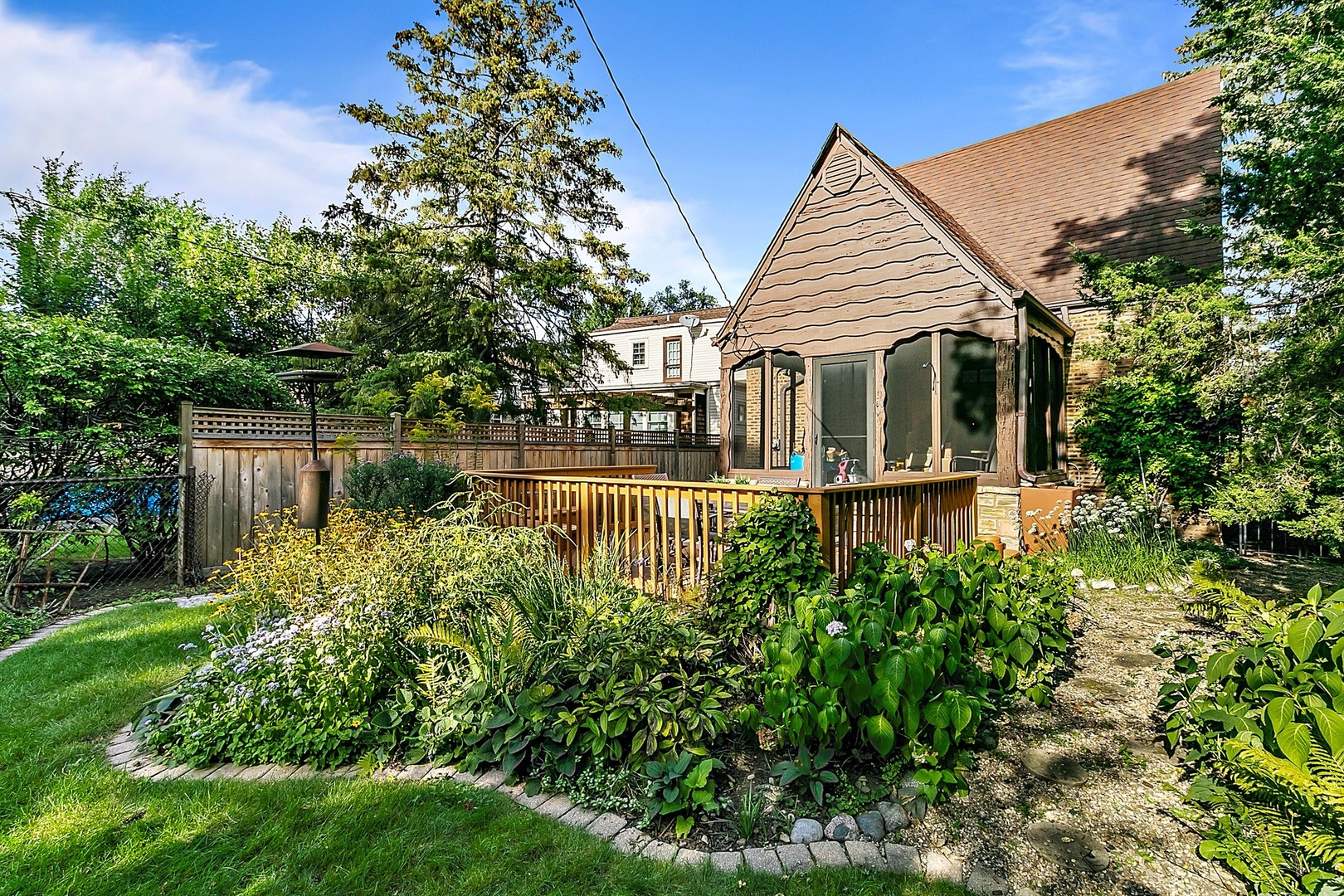 595 Selborne Road Riverside, IL 60546 - Photo 16 of 25 a front view of a house with a yard and potted plants