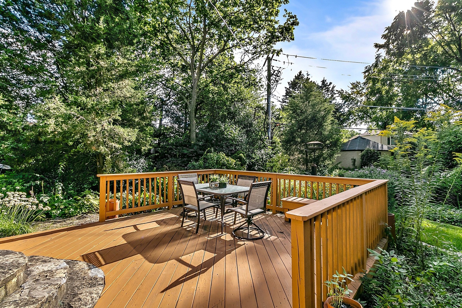 595 Selborne Road Riverside, IL 60546 - Photo 18 of 25 a view of a roof deck with couches and wooden fence