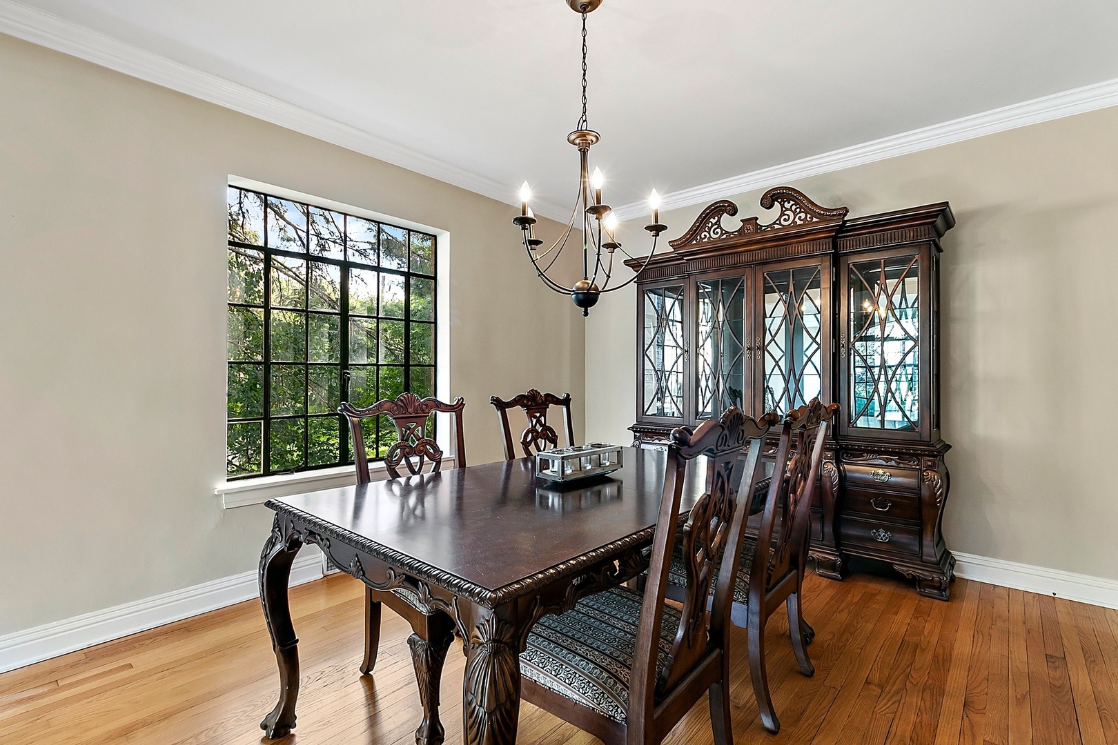 595 Selborne Road Riverside, IL 60546 - Photo 4 of 25 a view of a dining room with furniture window and wooden floor