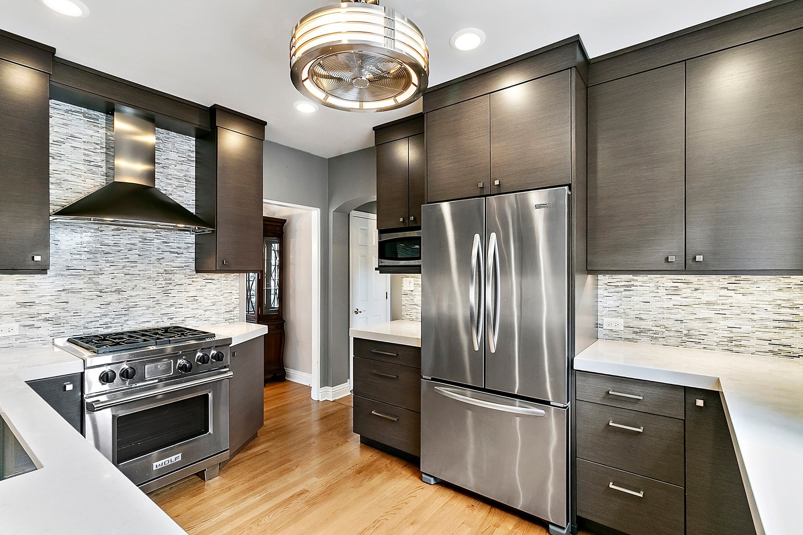 595 Selborne Road Riverside, IL 60546 - Photo 5 of 25 a kitchen with stainless steel appliances granite countertop a refrigerator and a stove top oven