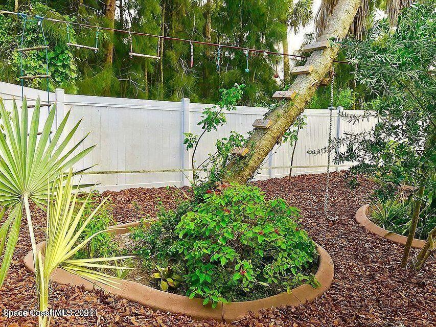 411 Audubon Drive Melbourne, FL 32901 - Photo 13 of 47 a view of a yard with plants