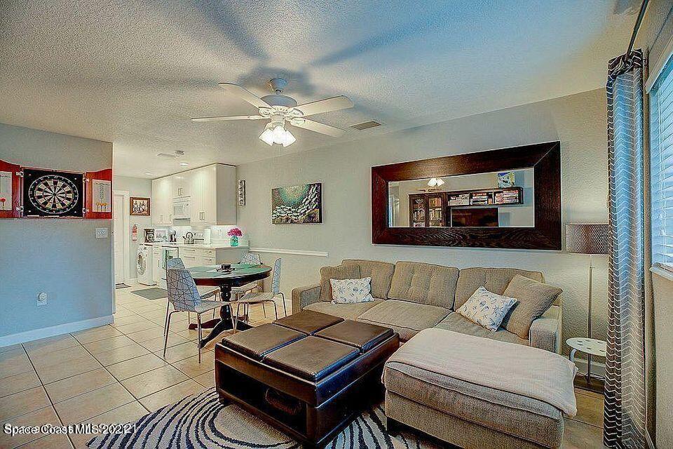 411 Audubon Drive Melbourne, FL 32901 - Photo 33 of 47 a living room with furniture and a ceiling fan