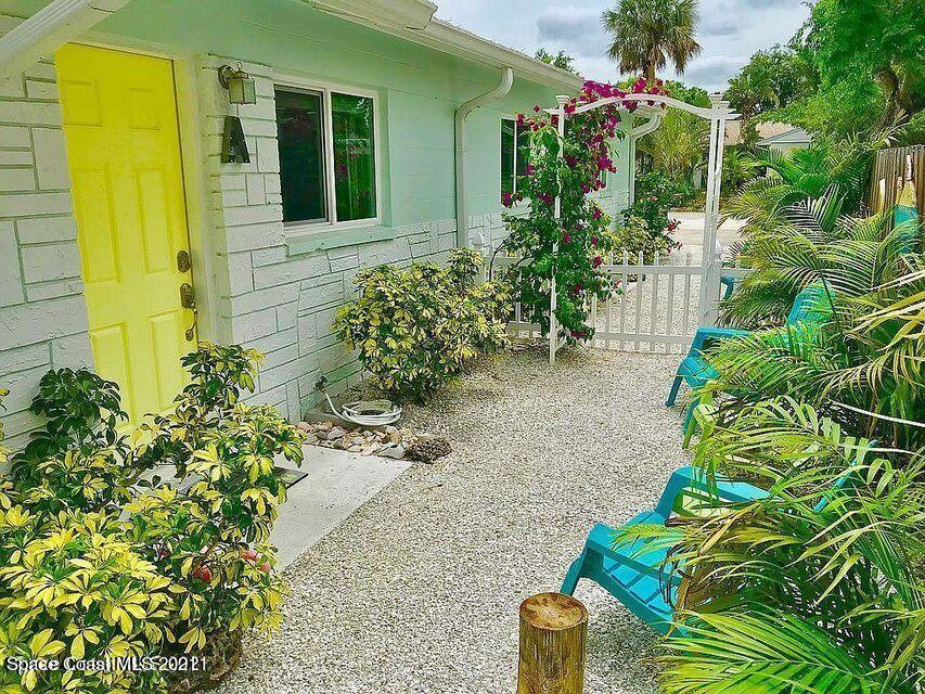 411 Audubon Drive Melbourne, FL 32901 - Photo 7 of 47 a front view of a house with a yard