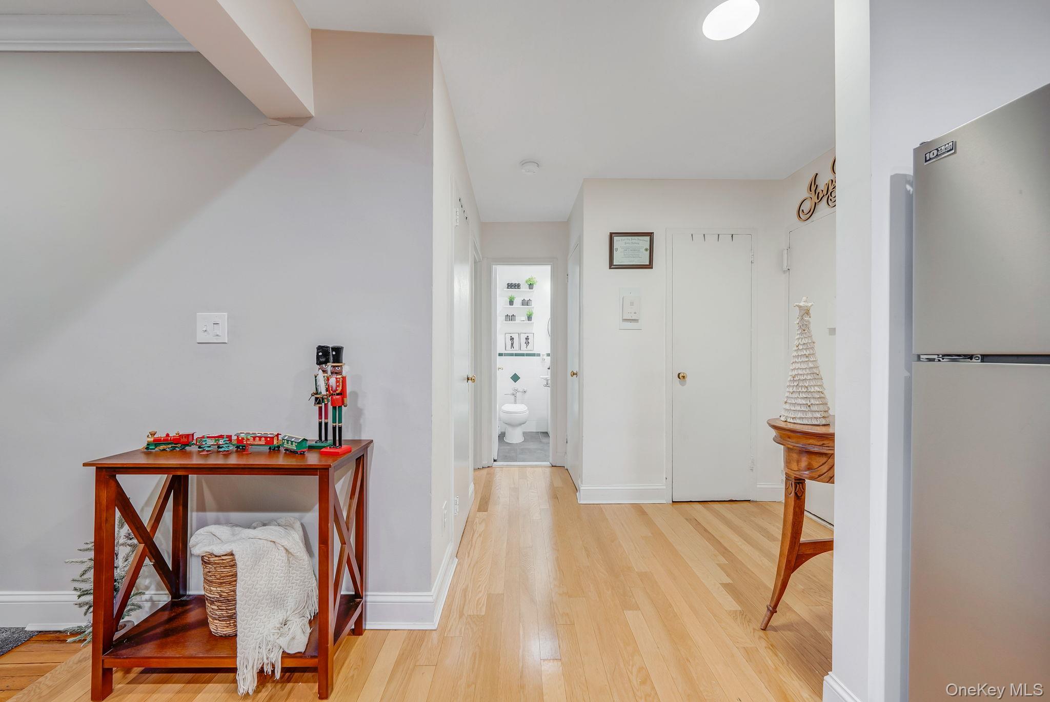 124 Smith Street, Unit 3F Freeport, NY 11520 - Photo 11 of 15 Hall featuring light wood-type flooring and baseboards