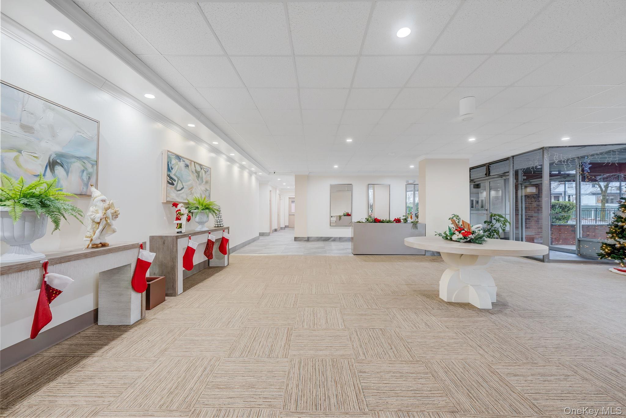 124 Smith Street, Unit 3F Freeport, NY 11520 - Photo 3 of 15 Common area featuring a paneled ceiling and recessed lighting