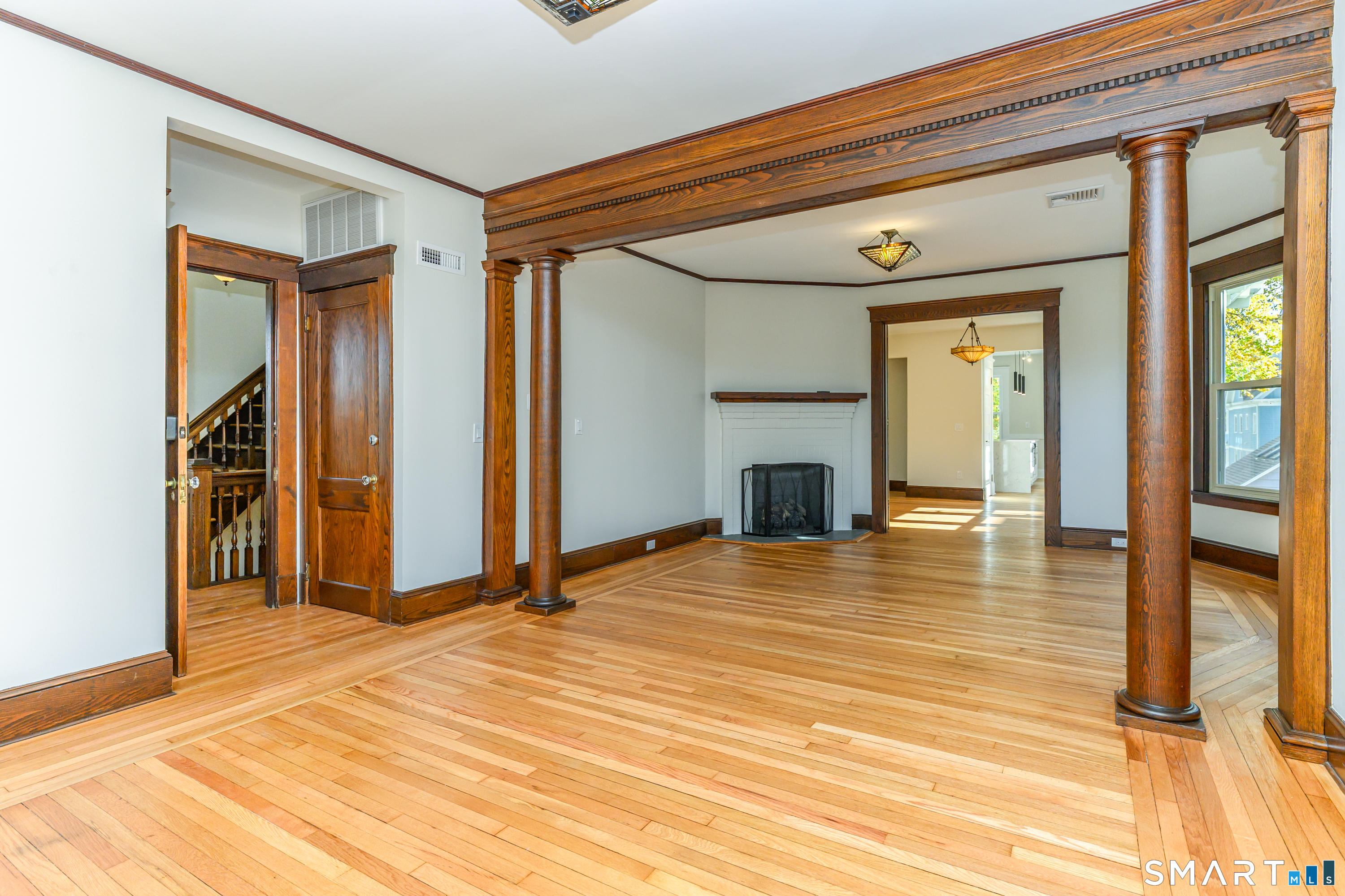 27 Hubinger Street, Unit 2 New Haven, CT 06511 - Photo 10 of 31 a view of a room with wooden floor and a window